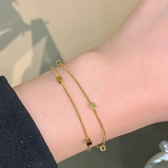 Double Layer Gold Toned Snake Chain bracelet With Cubic Beads